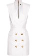 Vestido blanco con falda abotonada de Balmain, disponible en NET-A-PORTER (3095 euros)