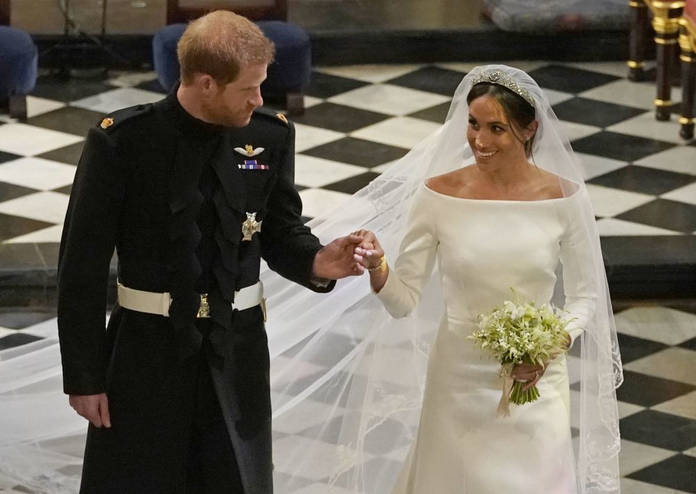 El príncipe Harry y Meghan Markle el día de su boda, en cuya...