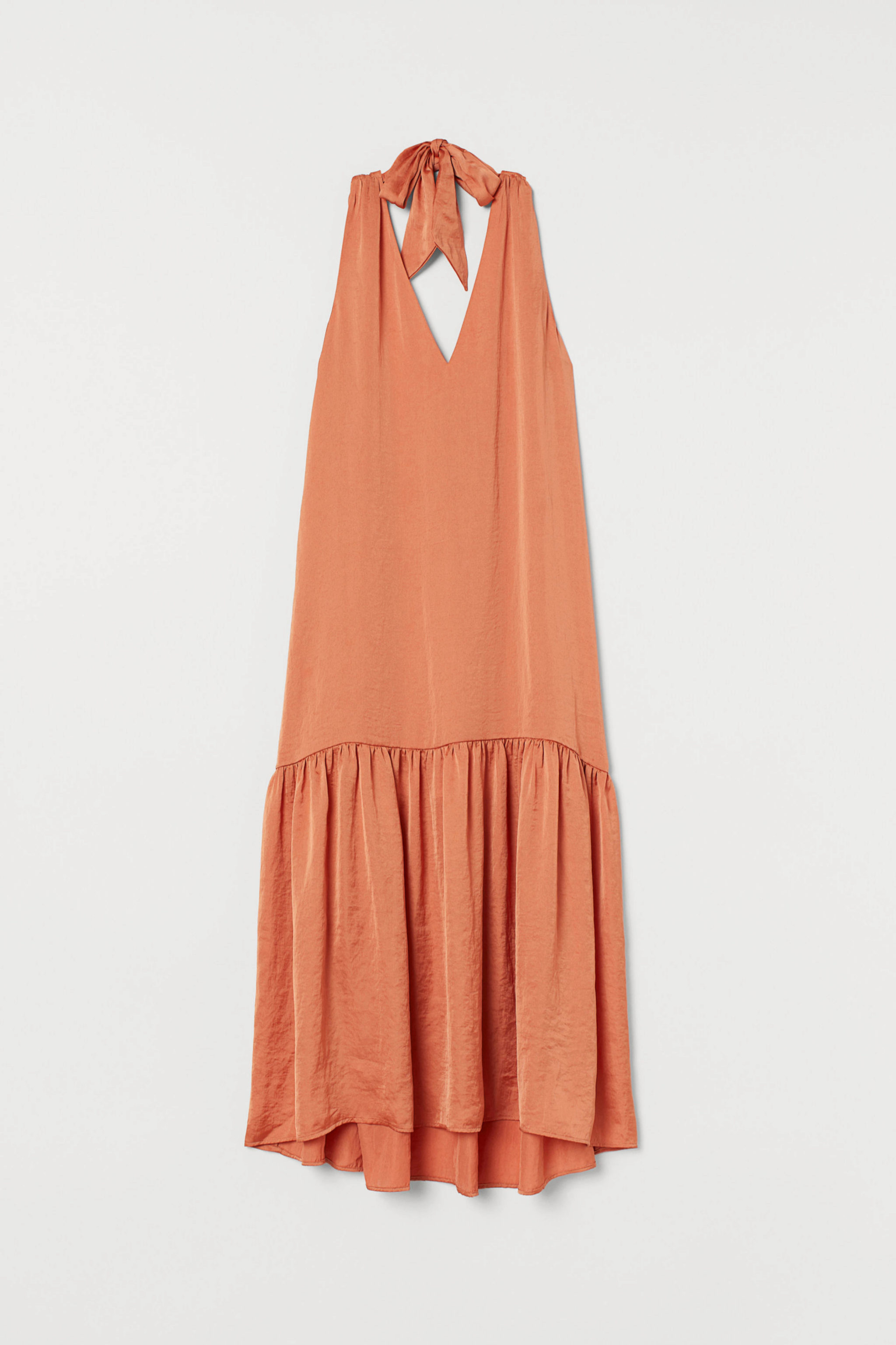 Vestido satinado en color melocotn de H&M (59,99)
