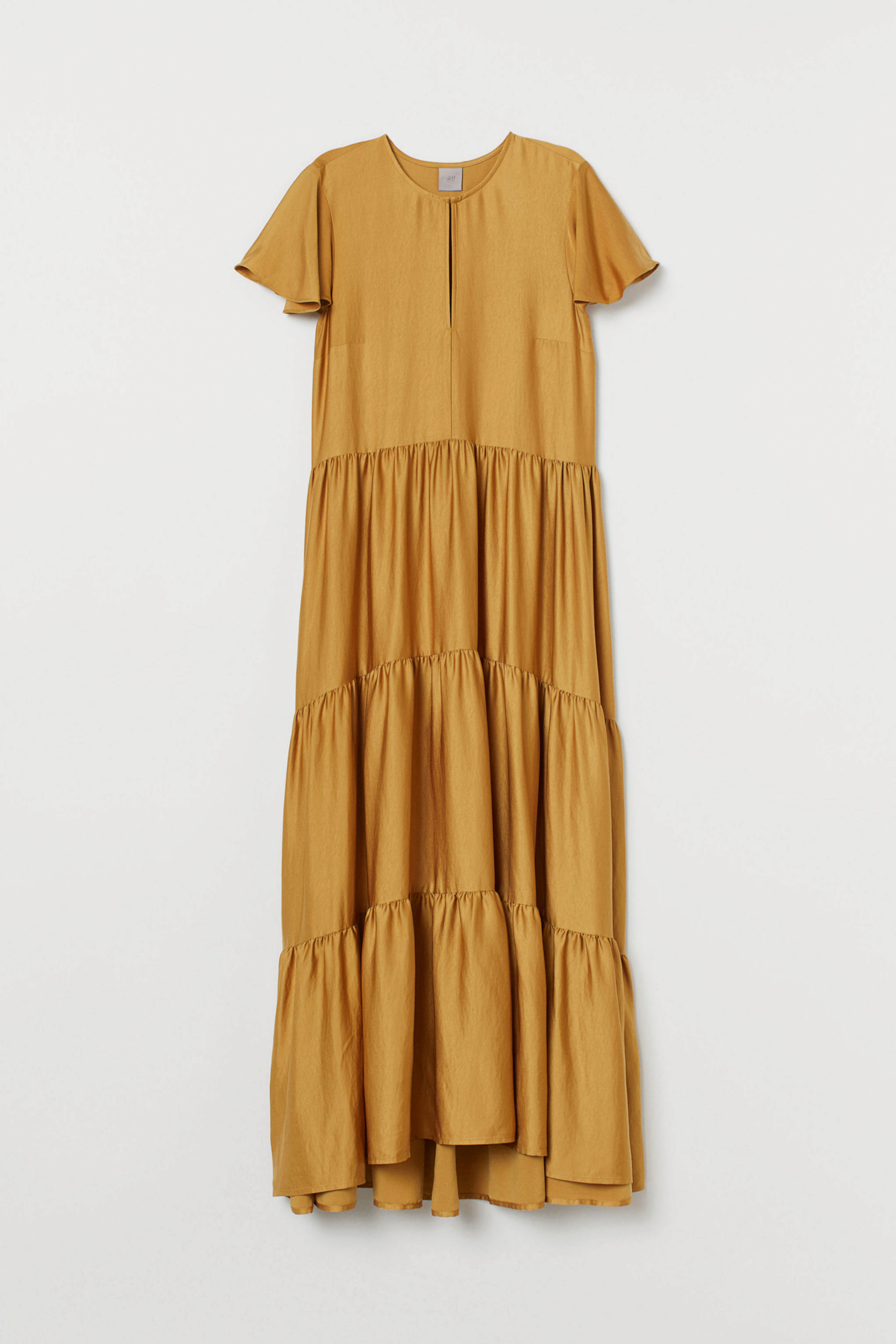 Vestido satinado en color mostaza de H&M (69,99¤)