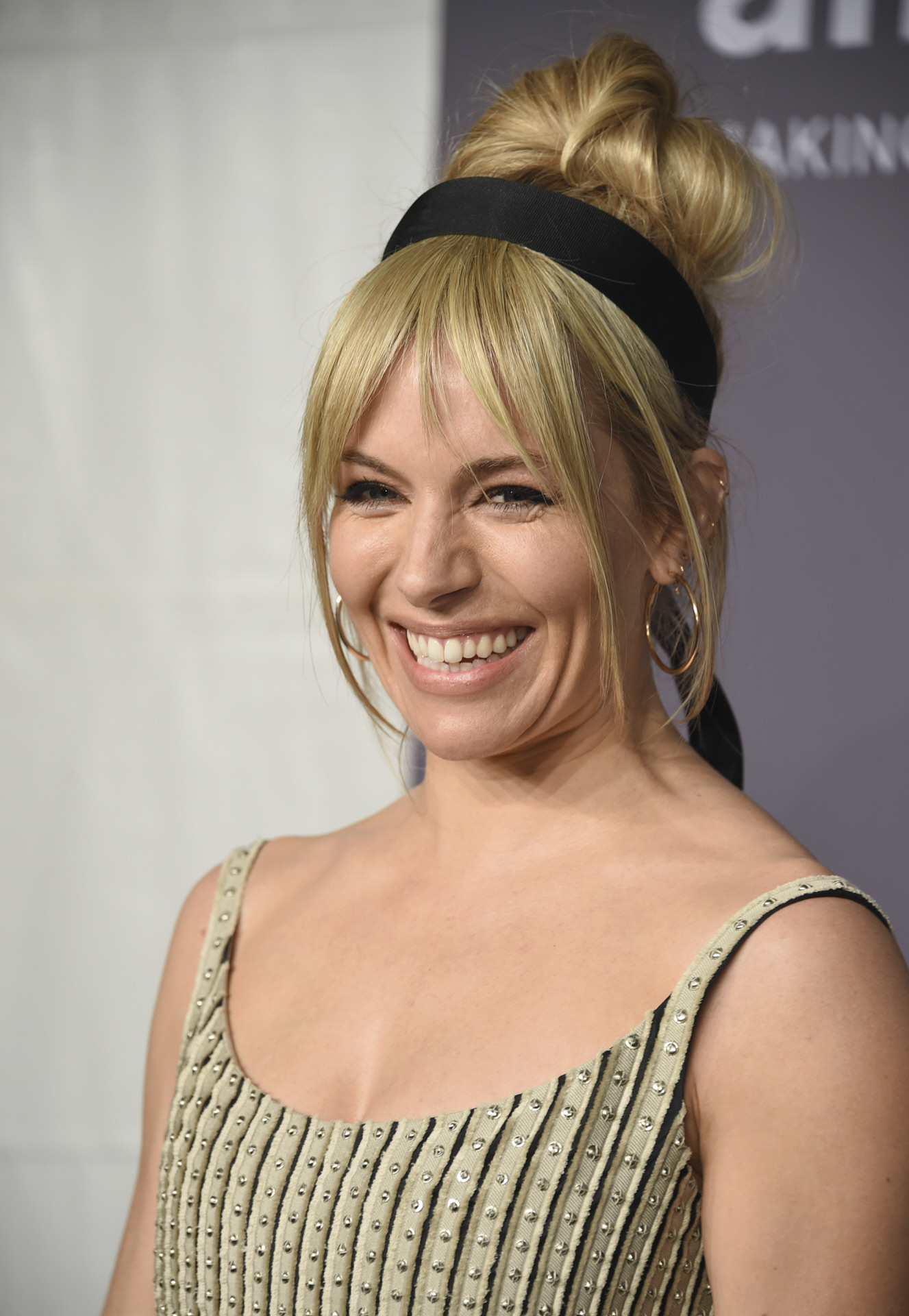 Sienna Miller with curtain bangs and headband.