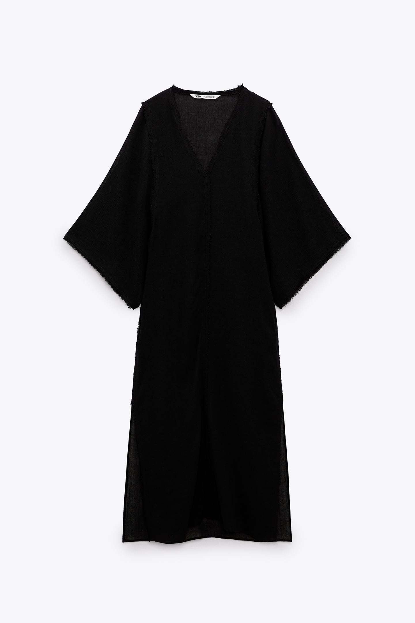 Vestido túnica negra de Zara.