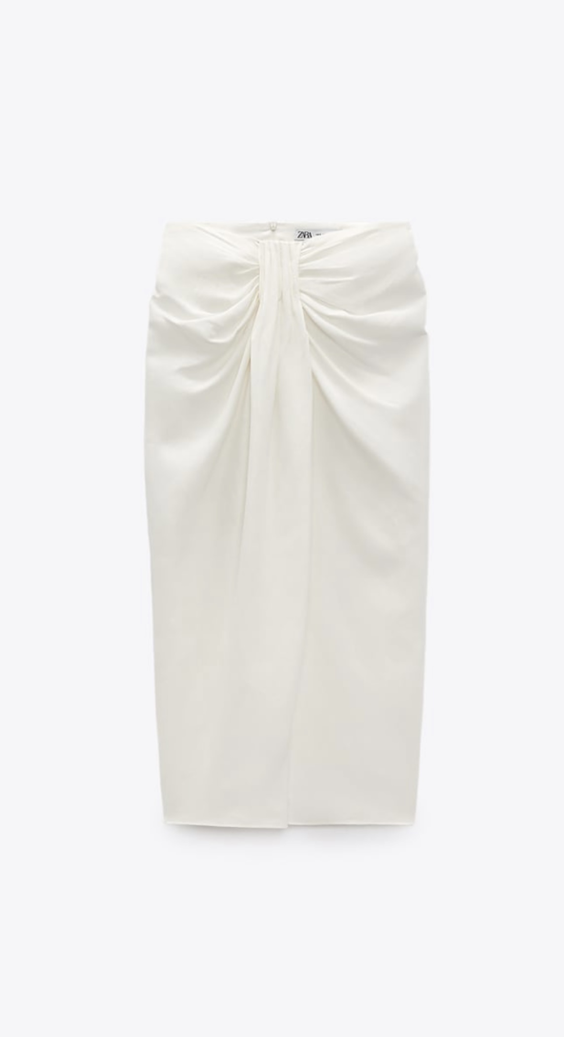 Una falda de lino blanca de Zara (39,95 euros).