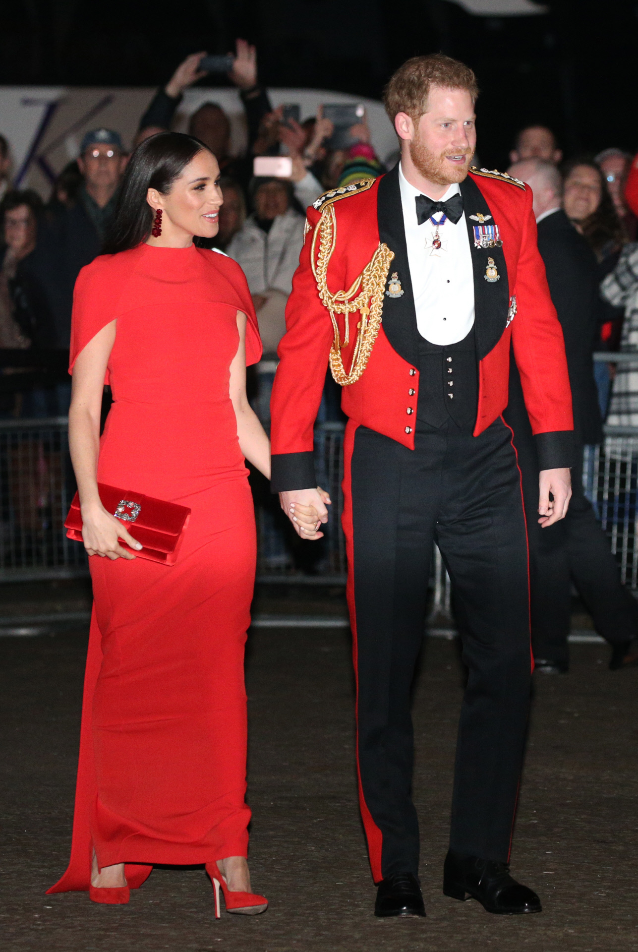 Meghan Markle y el príncipe Harry en una de sus visitas a Reino Unido tras desvincularse de la Casa Real.