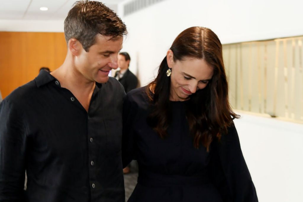 Jacinda Ardern supported and covered by her husband, Clarke Gayford, after announcing her resignation yesterday, January 19, in New Zealand.